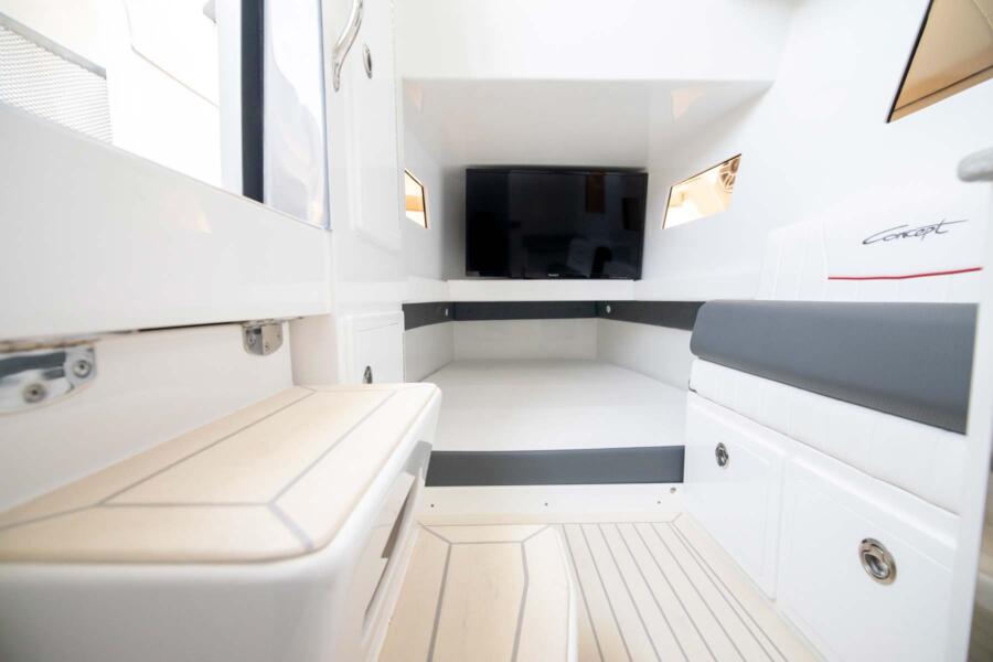 Spacious Interior: <p>The Open Deck has comfortable accommodations below deck under the console to shelter your crew from the elements. </p>
